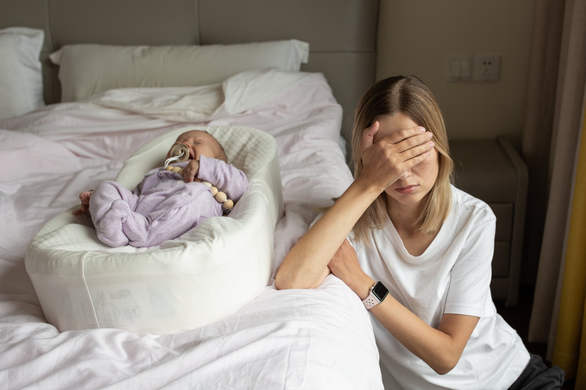 Tired Mother Suffering from experiencing postnatal depression. Stay home during coronavirus